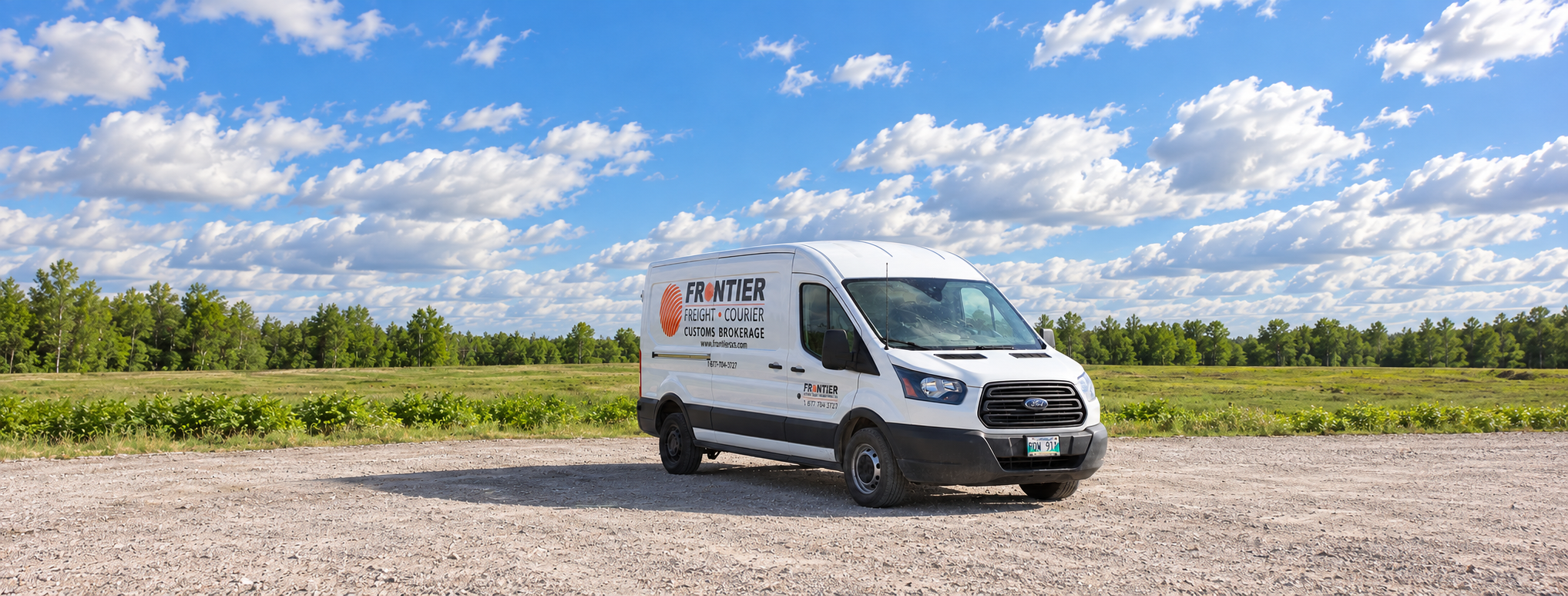 Frontier branded courier van with a Canadian countryside backdrop